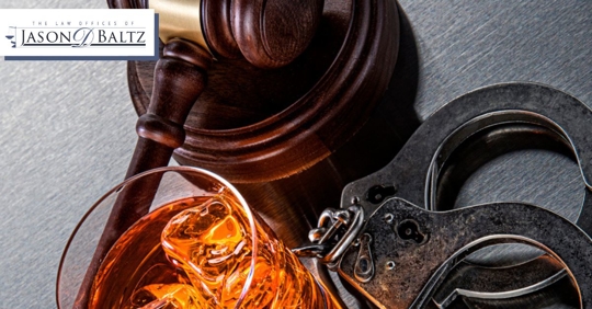 Gavel, alcoholic drink, and handcuffs